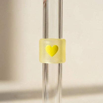 Close-up of the yellow heart test band on the glass straw