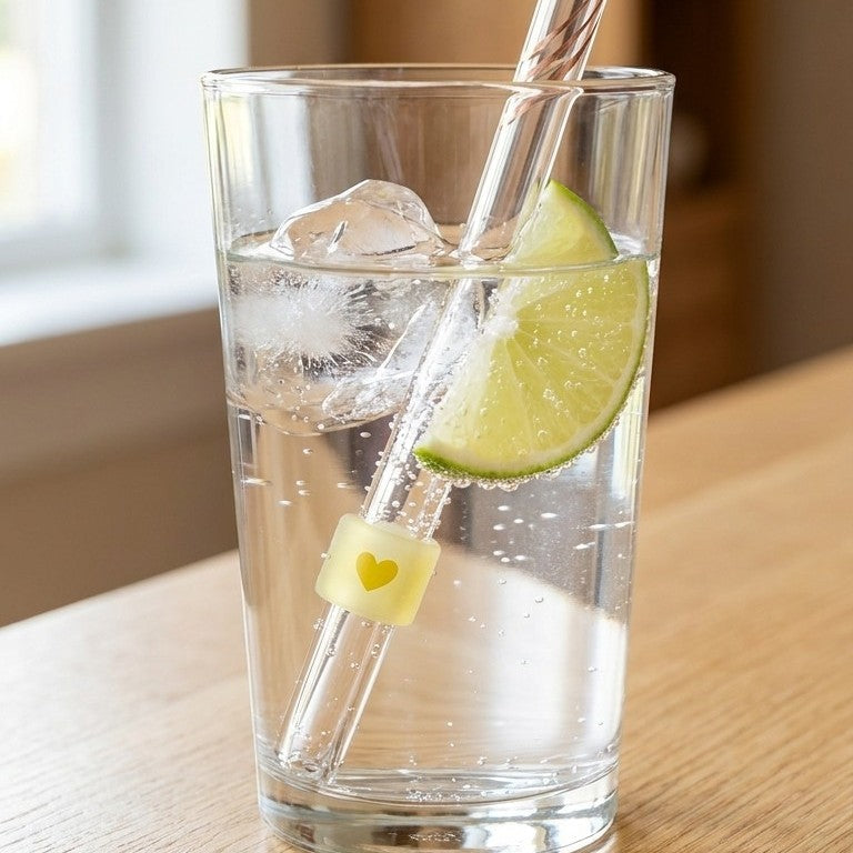 Glass test straw in a sparkling drink with lime
